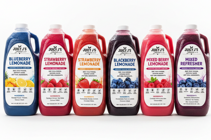 Six large plastic jugs of Juicy's bottled juice arranged in a row on a white background, including Blueberry Lemonade, Strawberry Lemonade, Strawberry Acai Lemonade, Blackberry Lemonade, Mixed Berry Lemonade, and Mixed Refresher.