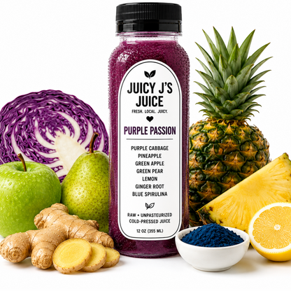 A bottle of Juicy J's Juice Purple Passion cold pressed juice centered on a white background, surrounded by its ingredients including a purple cabbage, green apple, pear, ginger, pineapple, lemon, and a small bowl of blue spirulina. The text 'PURPLE PASSION' is displayed at the top.