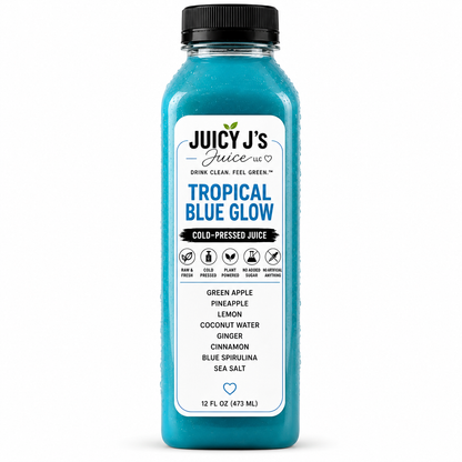 A 12 fl oz bottle of Juicy J's 'Tropical Blue Glow' cold-pressed juice, featuring a vibrant blue liquid and a white label with black and blue text, topped with a black cap on a white background.