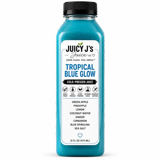 A 12 fl oz bottle of Juicy J's 'Tropical Blue Glow' cold-pressed juice, featuring a vibrant blue liquid and a white label with black and blue text, topped with a black cap on a white background.